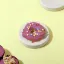 A Beautiful Purple Colour Sweet Wiggles N' Nibbles Donuts  on a cream colour table